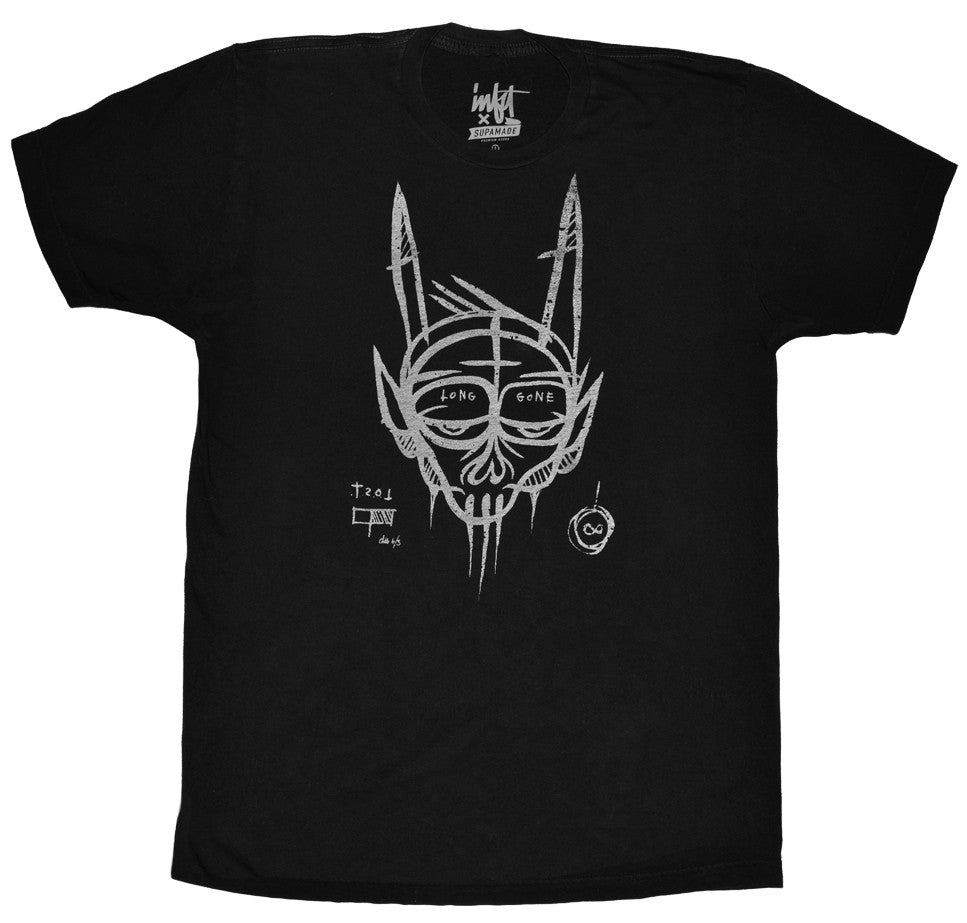 White print of a face on a black t-shirt.
